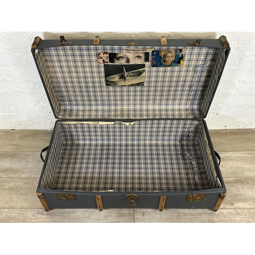 12 - A mid 20th century blue painted compressed fibre and beech banded travel trunk monogramed 