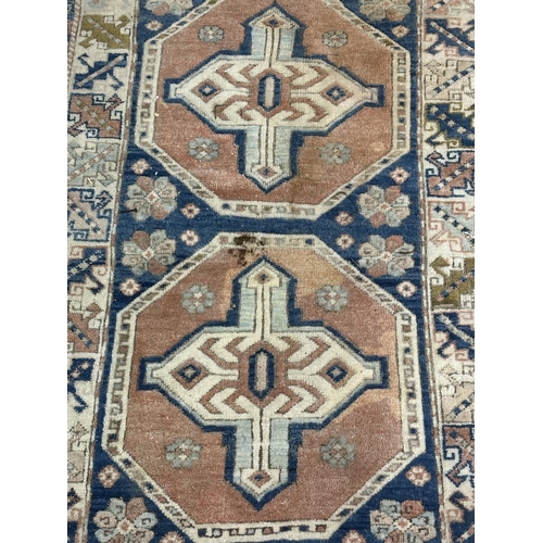 14 - A Persian style machine woven rug - approx. 150cm x 98cm