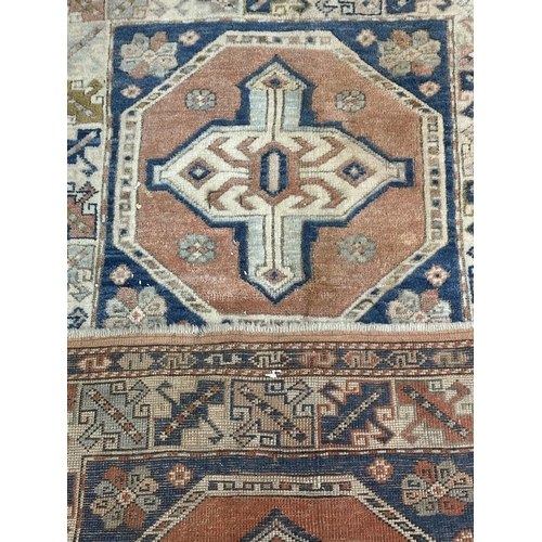 14 - A Persian style machine woven rug - approx. 150cm x 98cm