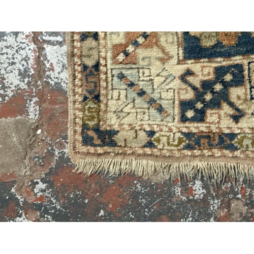 14 - A Persian style machine woven rug - approx. 150cm x 98cm