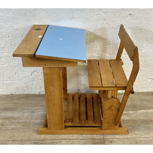 15 - A mid 20th century beech and blue laminate child's school desk - approx. 70cm high x 60cm wide x 80c... 