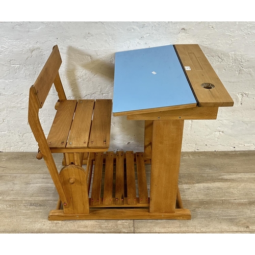 15 - A mid 20th century beech and blue laminate child's school desk - approx. 70cm high x 60cm wide x 80c... 