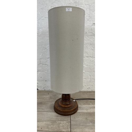 177 - A mid 20th century inlaid oak table lamp on circular base - approx. 80cm high including shade