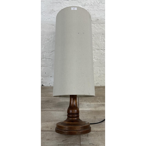 177 - A mid 20th century inlaid oak table lamp on circular base - approx. 80cm high including shade