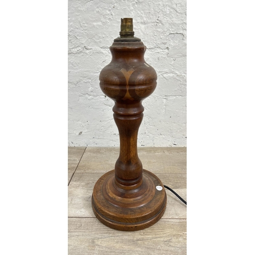 177 - A mid 20th century inlaid oak table lamp on circular base - approx. 80cm high including shade