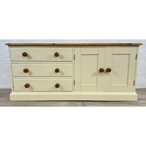 184 - A modern pine and cream painted TV stand - approx. 62cm high x 137cm wide x 45cm deep