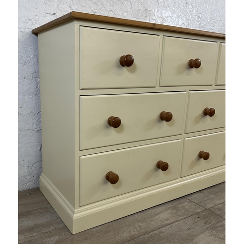 185 - A modern pine and cream painted chest of drawers - approx. 82cm high x 122cm wide x 45cm deep