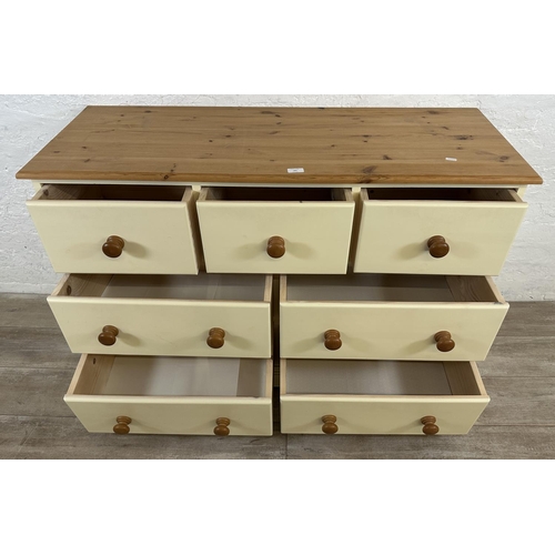 185 - A modern pine and cream painted chest of drawers - approx. 82cm high x 122cm wide x 45cm deep