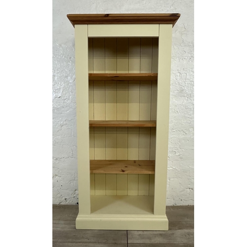 188 - A modern pine and cream painted four tier bookcase - approx. 137cm high x 66cm wide x 30cm deep