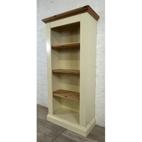 188 - A modern pine and cream painted four tier bookcase - approx. 137cm high x 66cm wide x 30cm deep