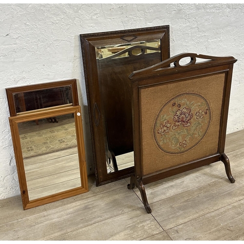 189 - Four items, one Edwardian mahogany and tapestry fire screen, and three wall mirrors, one Edwardian o... 