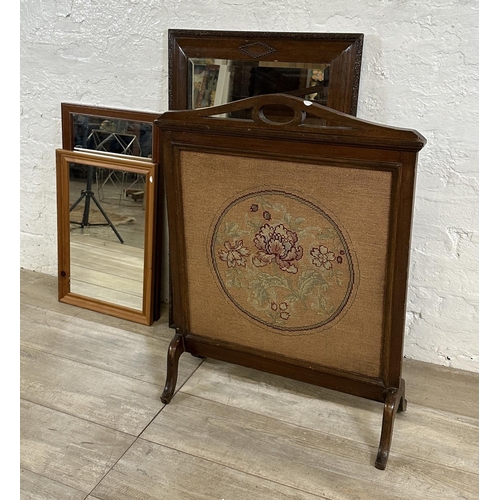 189 - Four items, one Edwardian mahogany and tapestry fire screen, and three wall mirrors, one Edwardian o... 