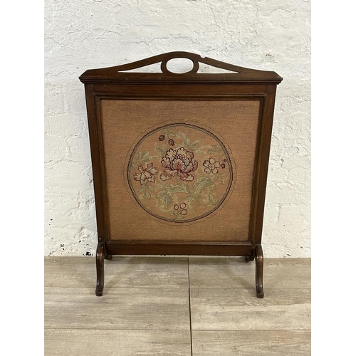 189 - Four items, one Edwardian mahogany and tapestry fire screen, and three wall mirrors, one Edwardian o... 