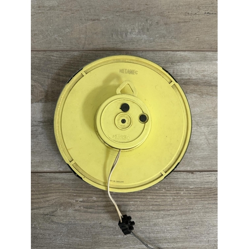 19 - A mid 20th century Metamec chrome plated and yellow plastic circular wall clock - approx. 20cm diame... 