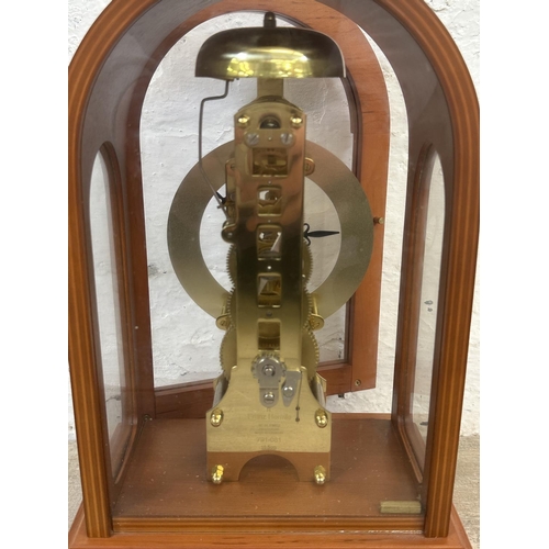 21 - A Franz Hermle & Sohn walnut effect cased key wind skeleton mantel clock with pendulum - approx. 30c... 