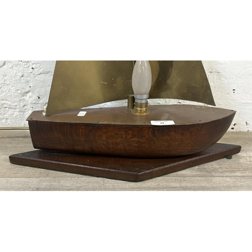 22 - A mid 20th century oak and brass novelty sailing boat table lamp - approx. 49cm high