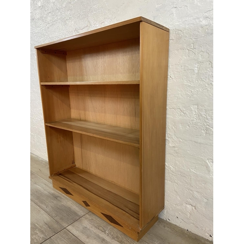 34 - A mid 20th century walnut three tier bookcase - approx. 100cm high x 83cm wide x 23cm deep