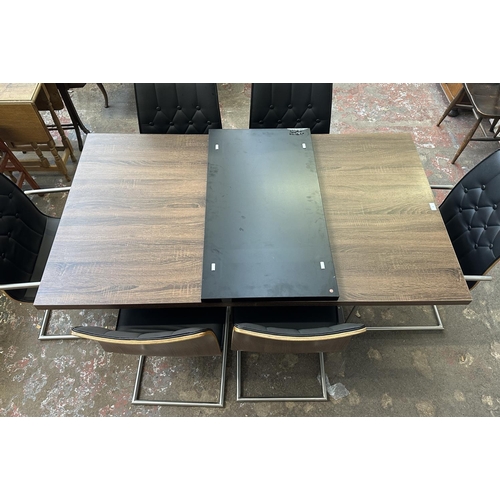 35 - A contemporary wood effect dining table on black plastic and brushed steel base and six bentwood, bl... 