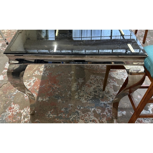 37 - A contemporary aluminium and black glass dining table - approx. 76cm high x 90cm wide x 160cm long