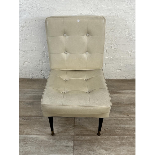 39 - A mid 20th century cream vinyl upholstered lounge chair on dansette legs - approx. 84cm high x 53cm ... 