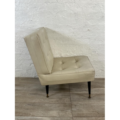 39 - A mid 20th century cream vinyl upholstered lounge chair on dansette legs - approx. 84cm high x 53cm ... 