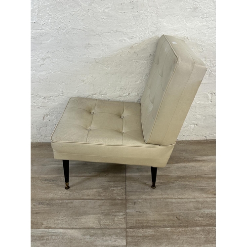 39 - A mid 20th century cream vinyl upholstered lounge chair on dansette legs - approx. 84cm high x 53cm ... 