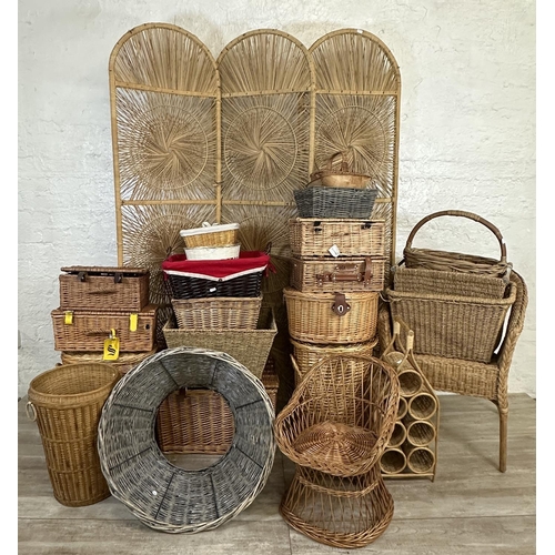 4 - A collection of wicker furniture to include three section folding dressing screen, baskets, bottle r... 