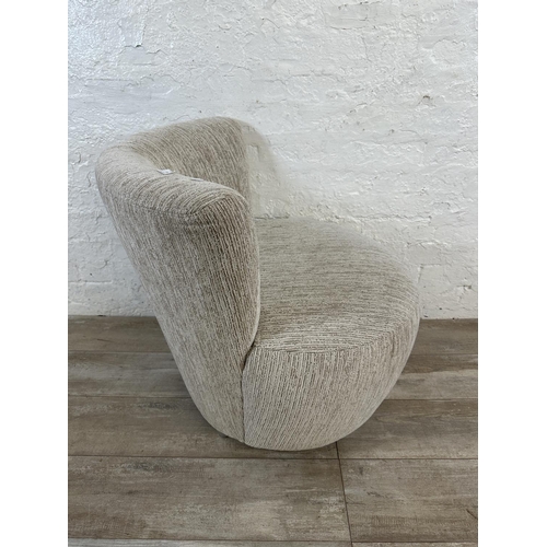 41 - A contemporary beige fabric upholstered accent chair - approx. 70cm high x 70cm wide x 56cm deep