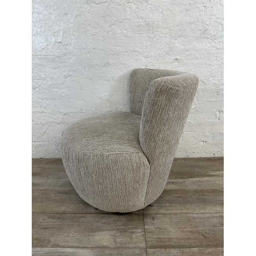 41 - A contemporary beige fabric upholstered accent chair - approx. 70cm high x 70cm wide x 56cm deep