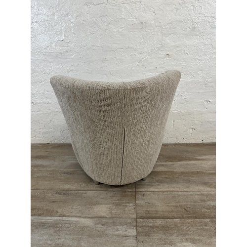 41 - A contemporary beige fabric upholstered accent chair - approx. 70cm high x 70cm wide x 56cm deep