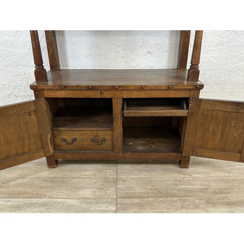 43 - A 19th century oak buffet with hand painted floral design back - approx. 126cm high x 110cm wide x 4... 