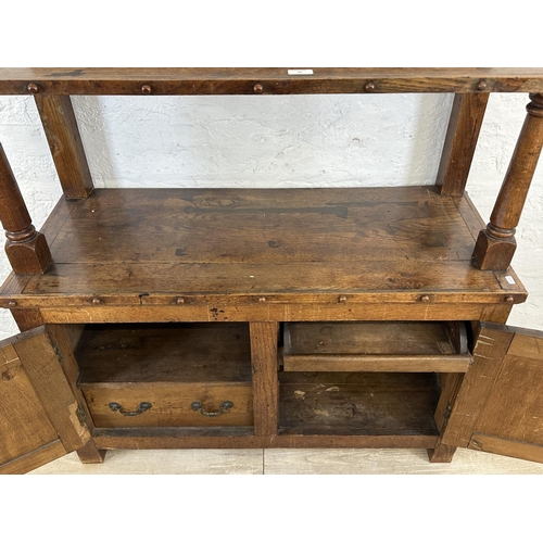 43 - A 19th century oak buffet with hand painted floral design back - approx. 126cm high x 110cm wide x 4... 