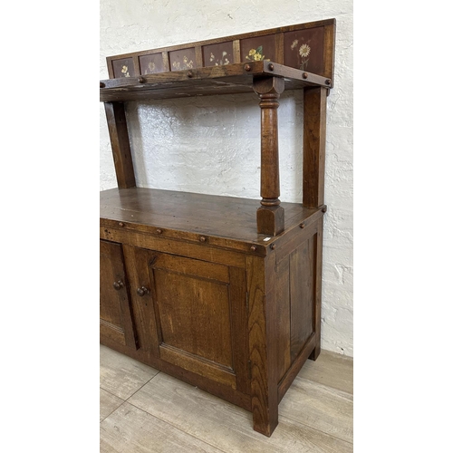 43 - A 19th century oak buffet with hand painted floral design back - approx. 126cm high x 110cm wide x 4... 