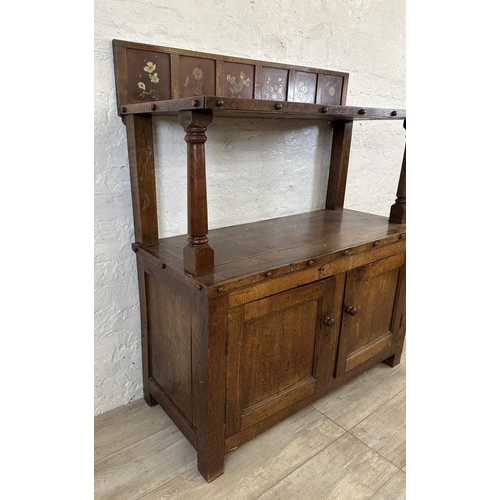 43 - A 19th century oak buffet with hand painted floral design back - approx. 126cm high x 110cm wide x 4... 