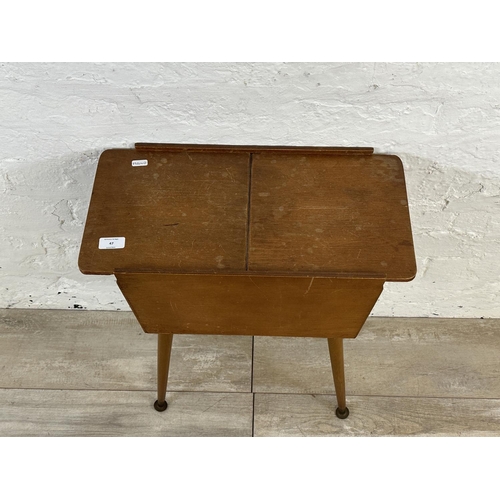 47 - A mid 20th century teak and plywood sewing box on beech splayed supports - approx. 57cm high x 26cm ... 