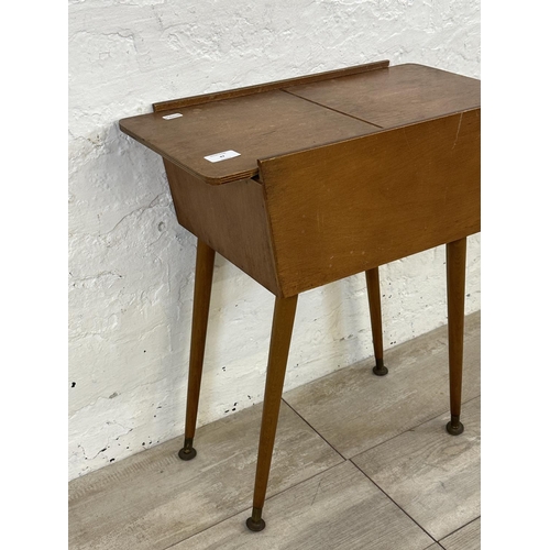 47 - A mid 20th century teak and plywood sewing box on beech splayed supports - approx. 57cm high x 26cm ... 