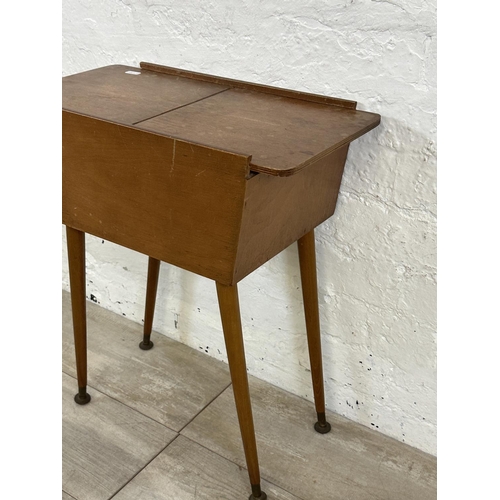 47 - A mid 20th century teak and plywood sewing box on beech splayed supports - approx. 57cm high x 26cm ... 