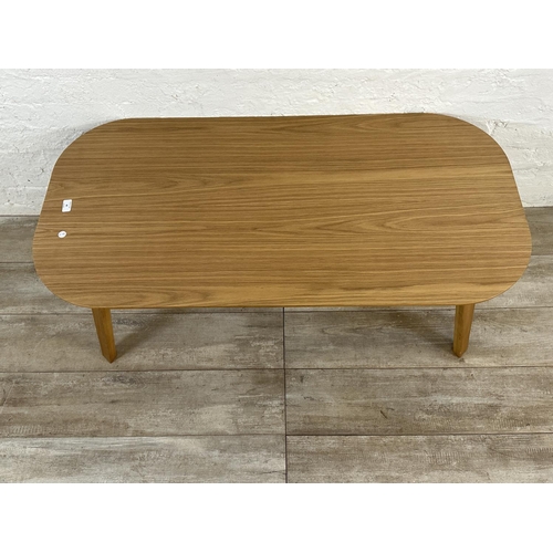 48 - A contemporary oak effect and bentwood coffee table - approx. 45cm high x 60cm wide x 120cm long