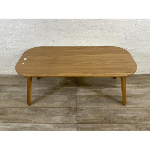 48 - A contemporary oak effect and bentwood coffee table - approx. 45cm high x 60cm wide x 120cm long