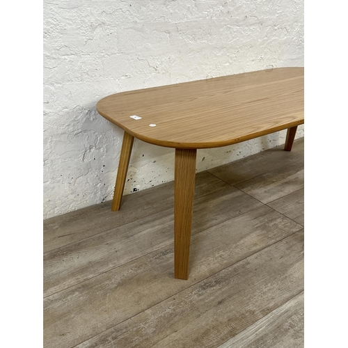 48 - A contemporary oak effect and bentwood coffee table - approx. 45cm high x 60cm wide x 120cm long