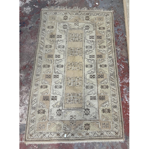 5 - A Persian style machine woven rug - approx. 210cm x 120cm