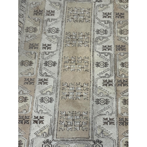 5 - A Persian style machine woven rug - approx. 210cm x 120cm