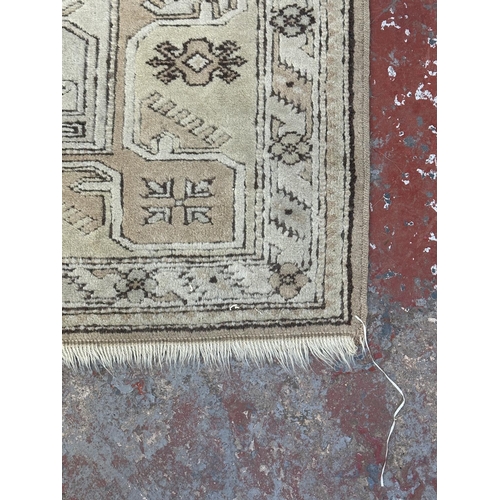 5 - A Persian style machine woven rug - approx. 210cm x 120cm