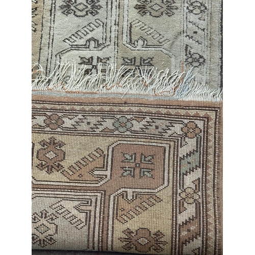 5 - A Persian style machine woven rug - approx. 210cm x 120cm