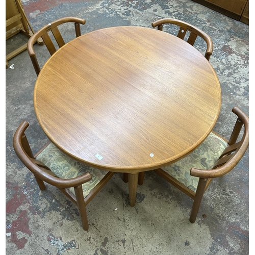 50 - A mid 20th century Danish Skovmand & Andersen teak circular dining table and four chairs - approx. 7... 