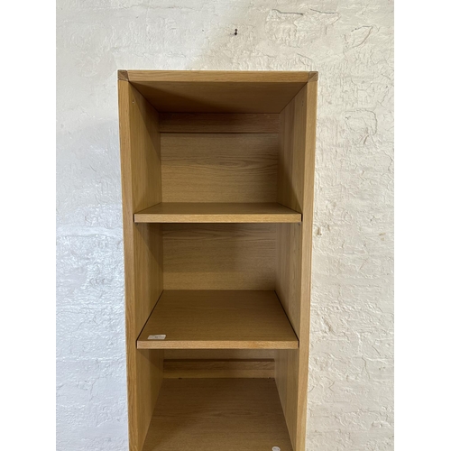 51 - A John Lewis oak effect four tier bookcase - approx. 184cm high x 40cm wide x 40cm deep