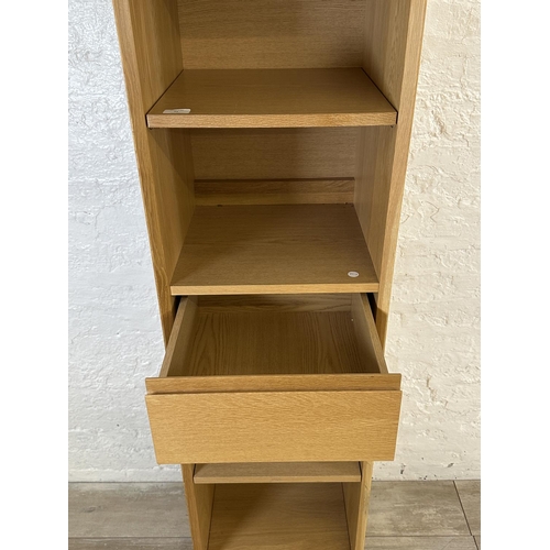 51 - A John Lewis oak effect four tier bookcase - approx. 184cm high x 40cm wide x 40cm deep