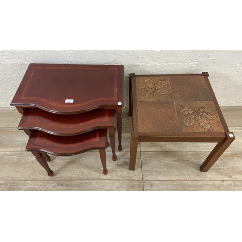 61 - Two pieces of furniture, one mid 20th century teak ceramic tile top side table and one mahogany nest... 