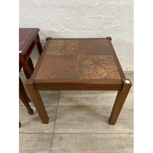 61 - Two pieces of furniture, one mid 20th century teak ceramic tile top side table and one mahogany nest... 