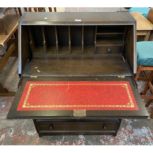 62 - A Priory carved oak bureau - approx. 99cm high x 76cm wide x 45cm deep